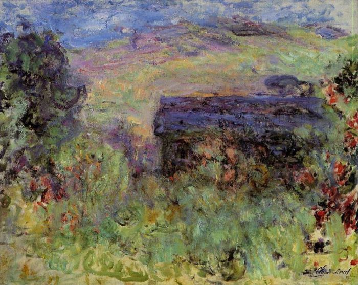 Claude Monet Peinture à l'huile - La maison vue à travers les roses